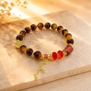 Handcrafted natural yellow tiger's eye womens feng shui bracelet featuring a detailed silver koi fish charm, 24h sound-bath calibrated at 528Hz, displayed within the signature white Luxe Abundance Box for 2026 energy alignment.