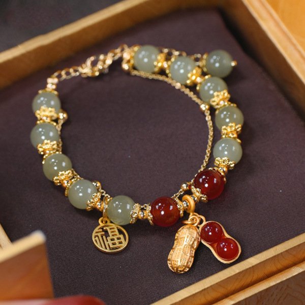 "The Abundance Harvest" – Natural Jade Lucky Peanut & Fu Blessing Bracelet | 2026 Prosperity Talisman 1 Double-strand jade and red agate bracelet with golden peanut charm for wealth manifestation