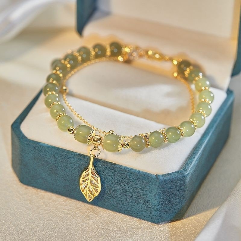 "The Abundance Harvest" – Natural Jade Lucky Peanut & Fu Blessing Bracelet | 2026 Prosperity Talisman 2 Elegant jade bead bracelet with golden leaf and peanut charms in a luxury gift box