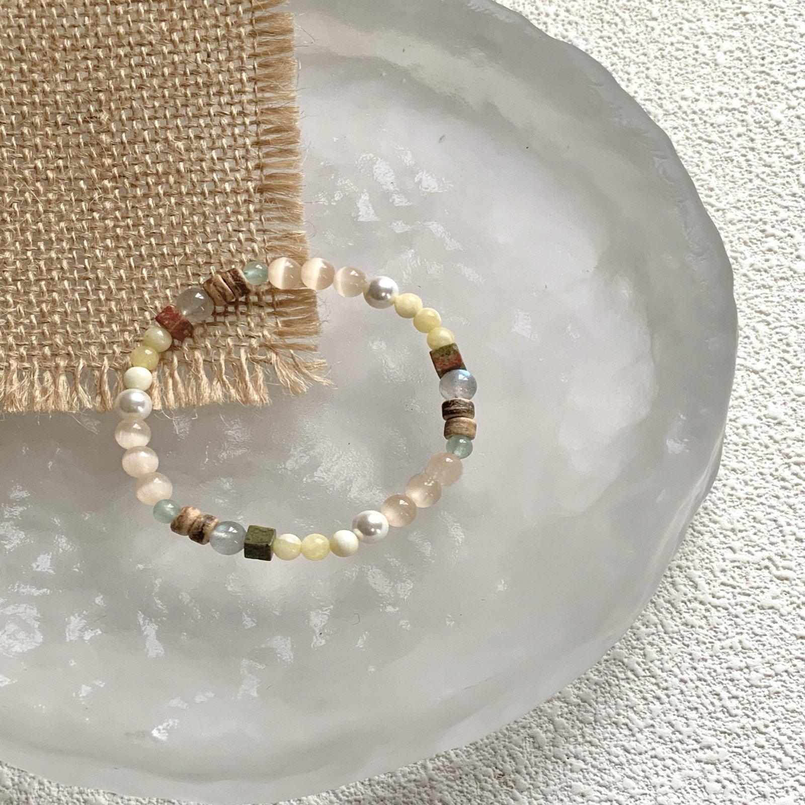 "The Visionary’s Path" – Natural Cat’s Eye Stone Bracelet with Pearls | Intuition & Protection Talisman 2 Close-up of iridescent cat’s eye beads and natural gemstone accents on beige fabric
