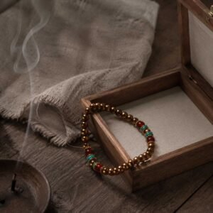 Close-up of a curated minimalist copper bracelet with clean, elegant lines, resting peacefully inside a simple natural wooden box under gentle mountain light.