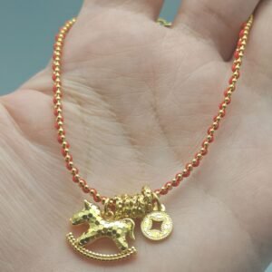 Handcrafted copper horse bracelet for instant prosperity held in hand