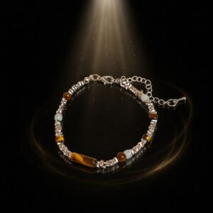 Artisan Tiger's Eye bracelet for 2026 protection, shown on a white ritual pedestal with silver accents.